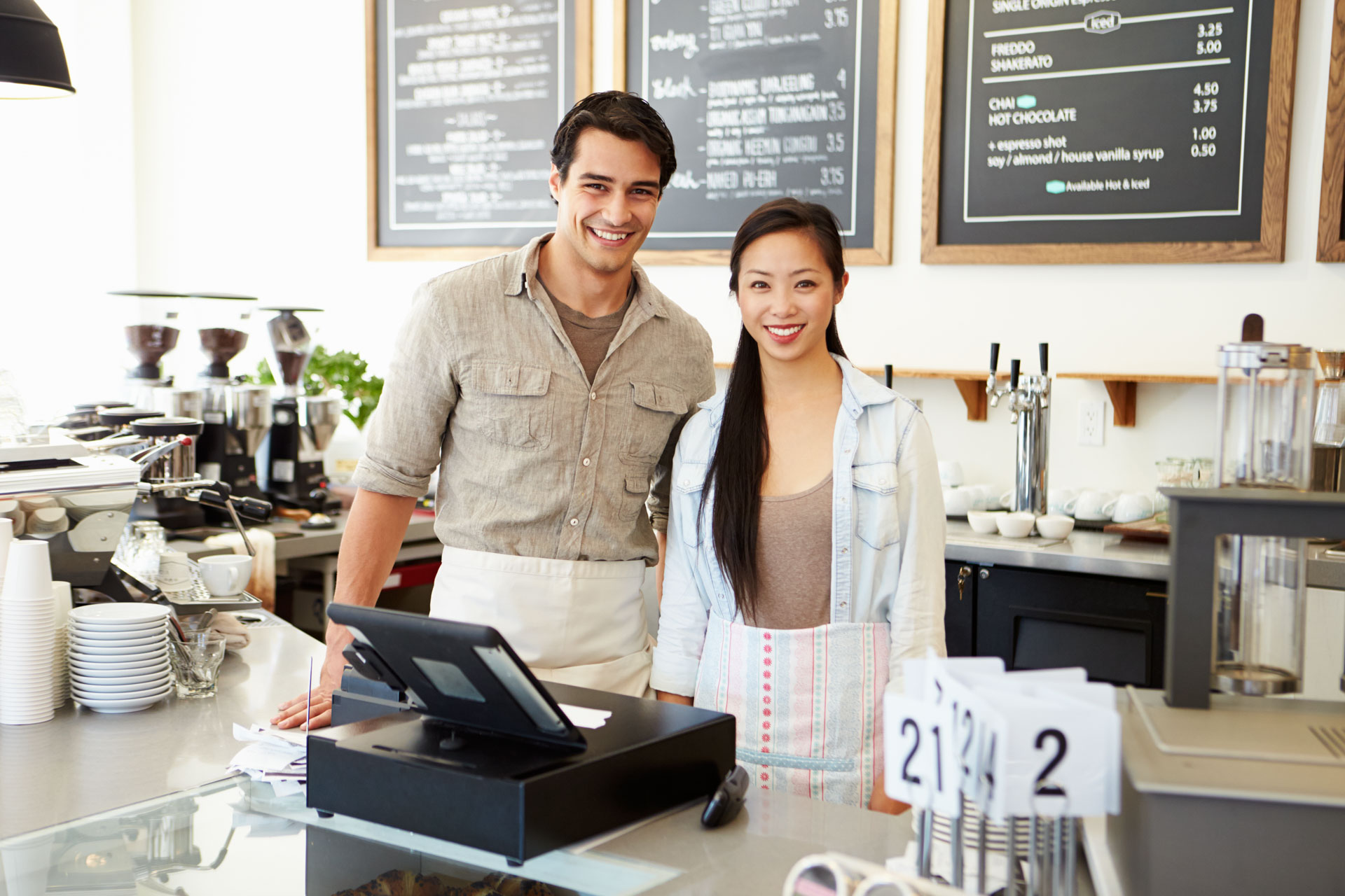 young man woman managing coffee shop cafe after brisbane asset finance and equipment finance